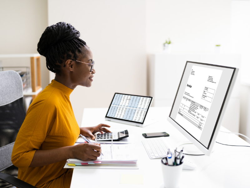 woman working on digital invoice with a calculator woman working on digital invoice with a calculator